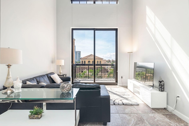 living room with a towering ceiling