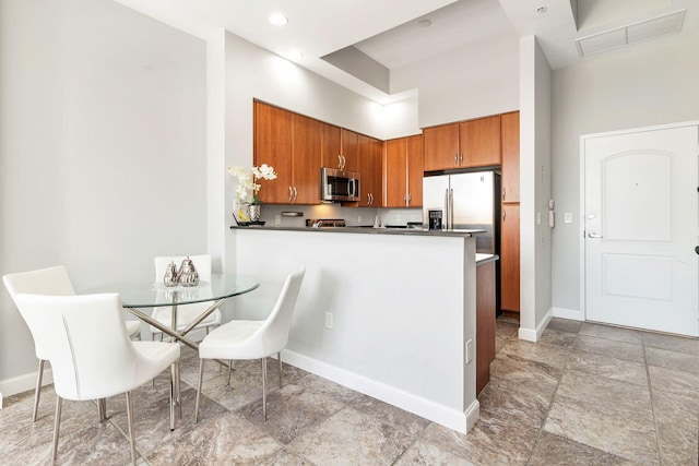 kitchen featuring kitchen peninsula and stainless steel appliances