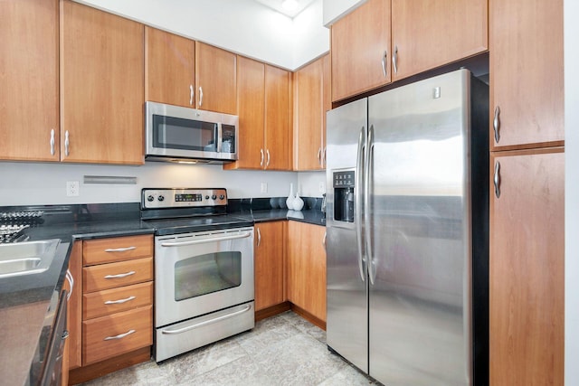 kitchen with appliances with stainless steel finishes and sink