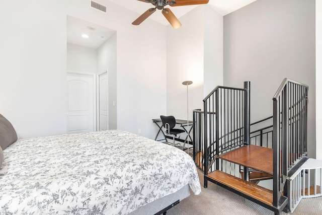 bedroom featuring ceiling fan and carpet