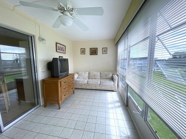 interior space with ceiling fan