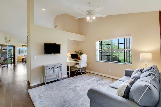 living room featuring ceiling fan, wood-type flooring, plenty of natural light, and high vaulted ceiling