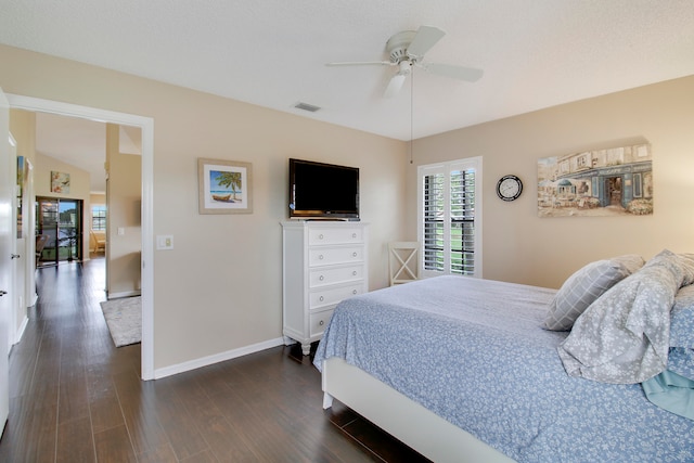 bedroom featuring ceiling fan and dark hardwood / wood-style floors