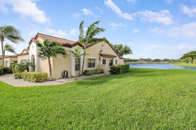 view of front of property with a water view and a front yard