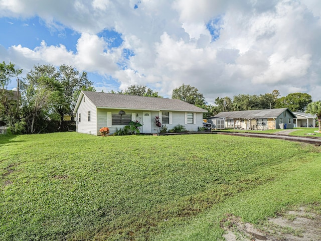 ranch-style home with a front yard