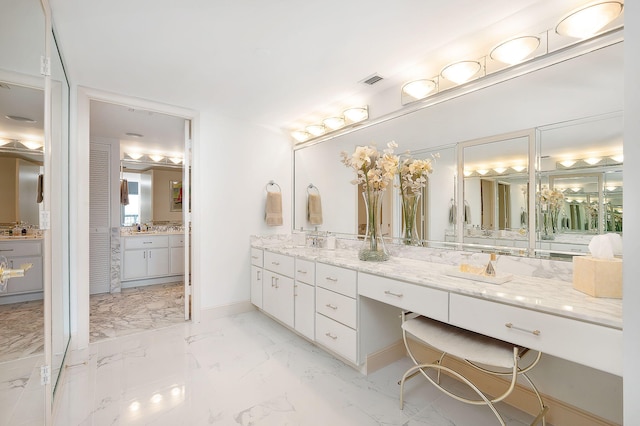 4001 N Ocean Blvd Ph 3, Boca Raton, FL 33431 - bathroom with vanity, marble finish floors, and baseboards