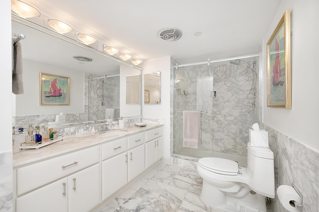 bathroom featuring vanity, toilet, and a shower with door