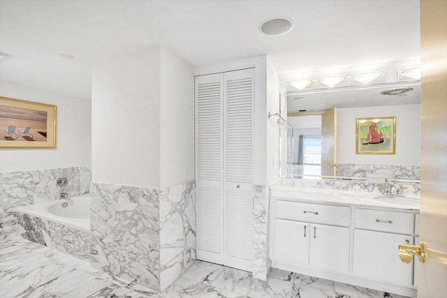 4001 N Ocean Blvd Ph 3, Boca Raton, FL 33431 - bathroom with a closet, marble finish flooring, vanity, a bath, and tile walls