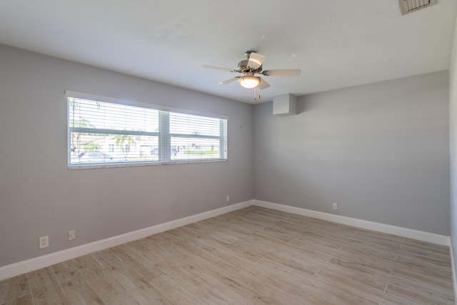 empty room featuring light hardwood / wood-style flooring and ceiling fan