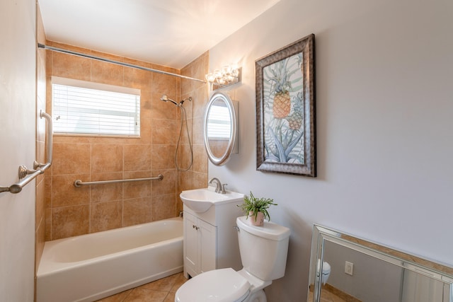 full bathroom with vanity, tiled shower / bath, toilet, and tile patterned floors