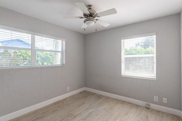 unfurnished room with light wood-type flooring and ceiling fan