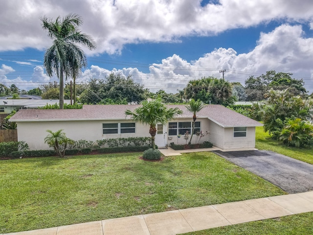 ranch-style house with a front lawn