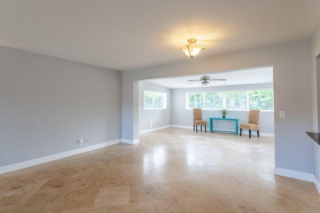 unfurnished room featuring ceiling fan