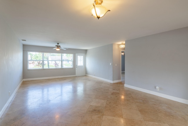 unfurnished room featuring ceiling fan