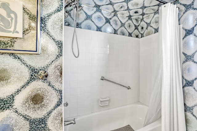 bathroom featuring shower / bath combo with shower curtain