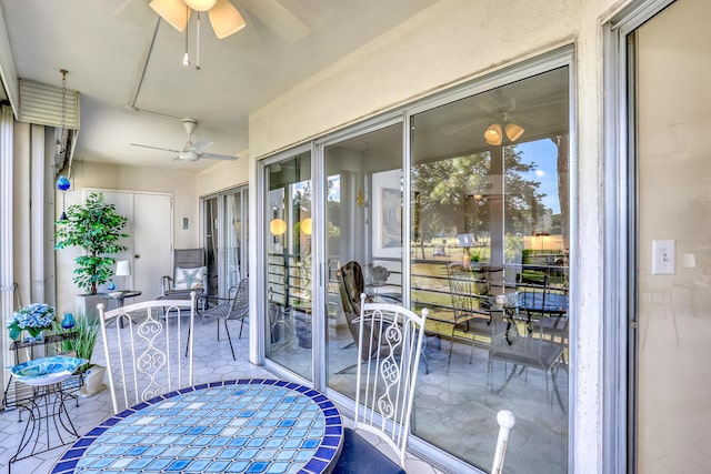 sunroom / solarium with ceiling fan