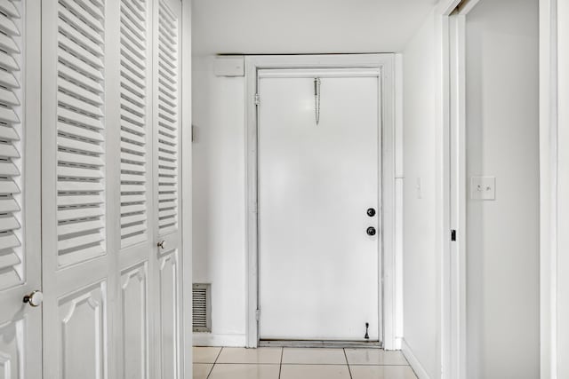 interior space with light tile patterned floors