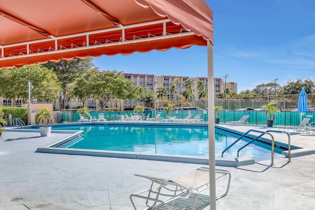 view of swimming pool with a patio