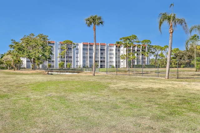 view of home's community featuring a lawn