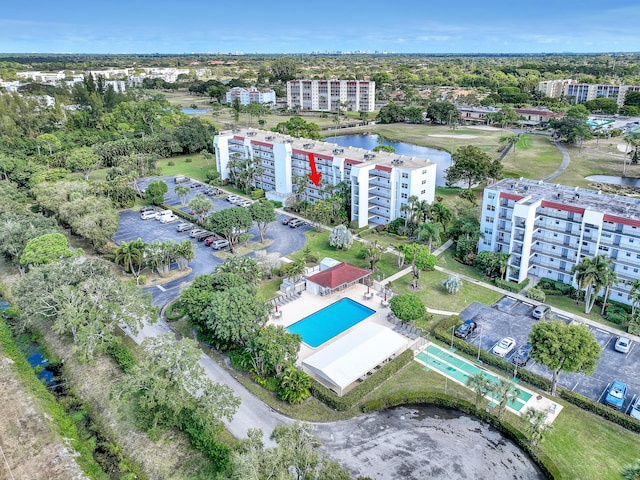 birds eye view of property with a water view