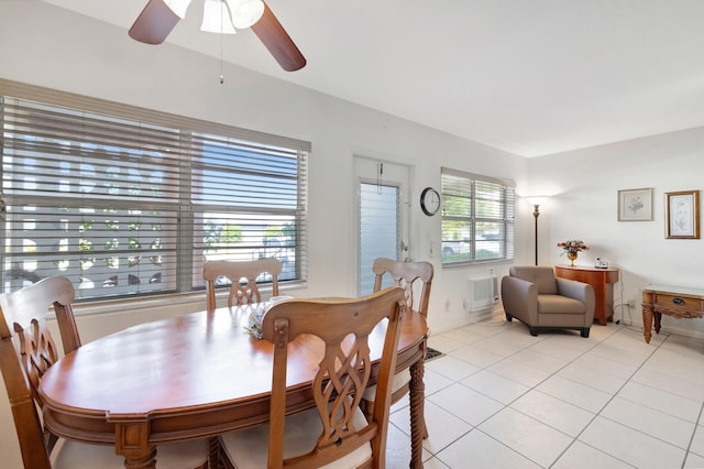 tiled dining area featuring plenty of natural light and ceiling fan