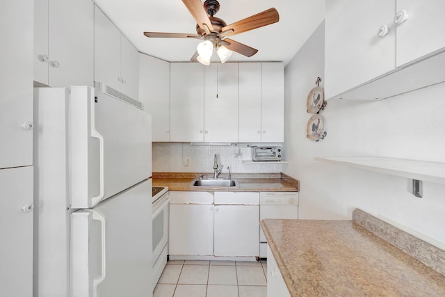 kitchen featuring white cabinets, sink, backsplash, and white appliances