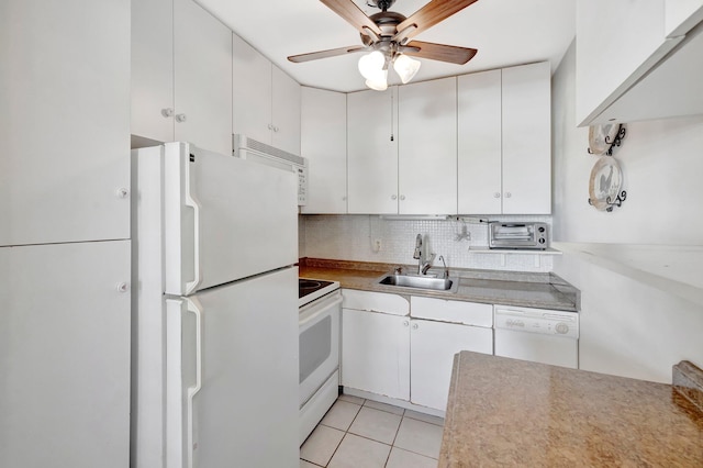 kitchen featuring backsplash, sink, white cabinets, and white appliances