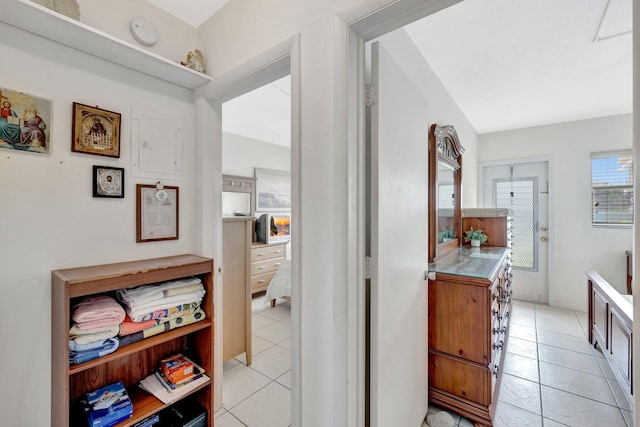 hallway featuring light tile patterned floors