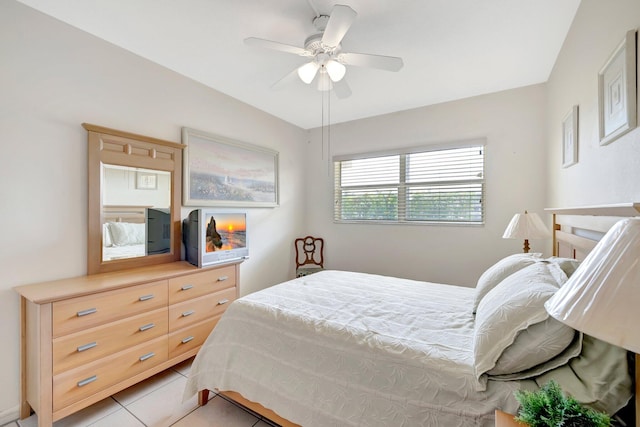 tiled bedroom with ceiling fan