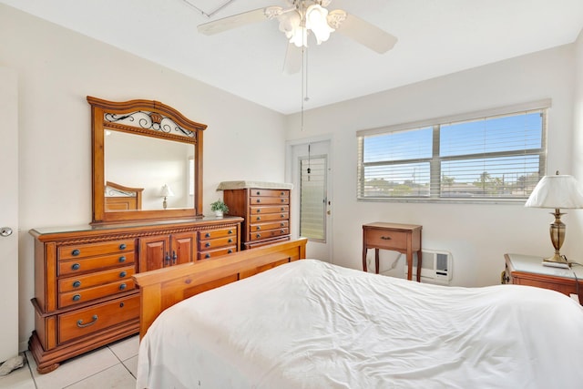 bedroom with ceiling fan and light tile patterned flooring