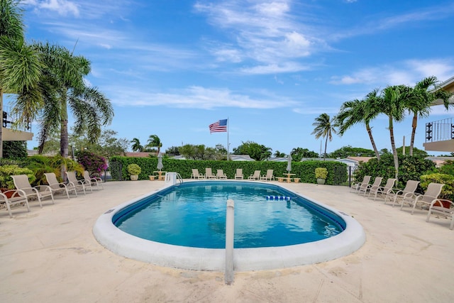 view of swimming pool featuring a patio area