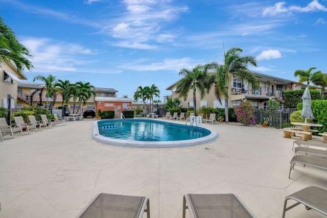 view of swimming pool featuring a patio area