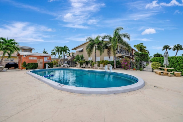 view of swimming pool featuring a patio area