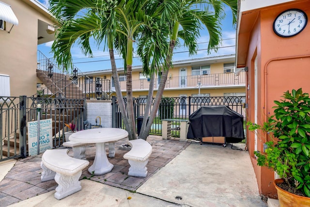 view of patio / terrace featuring a grill and a balcony