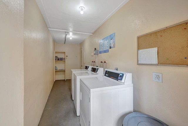 clothes washing area featuring washing machine and clothes dryer