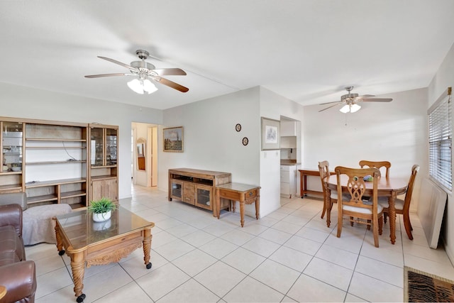 living room featuring light tile patterned flooring and ceiling fan