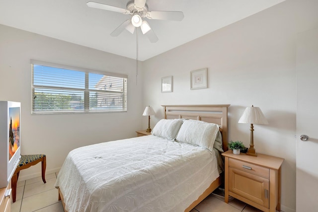 tiled bedroom with ceiling fan