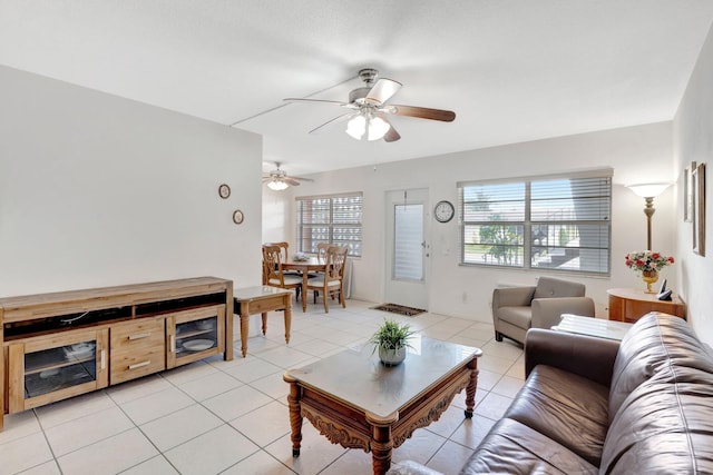 tiled living room with ceiling fan