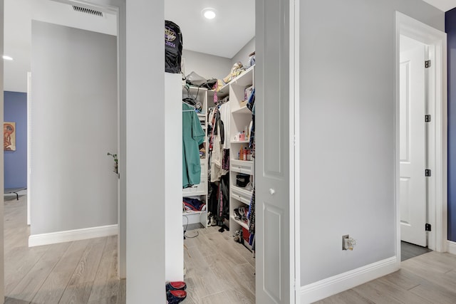 spacious closet featuring light wood-type flooring