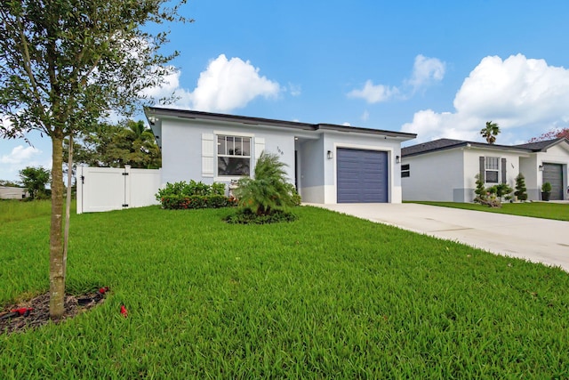 view of front of property with a front lawn and a garage