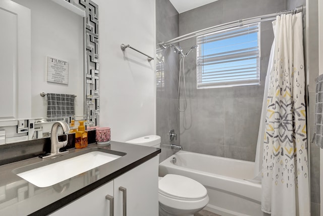 full bathroom with vanity, shower / bath combo, and toilet