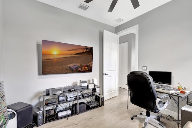 office featuring light hardwood / wood-style floors and ceiling fan