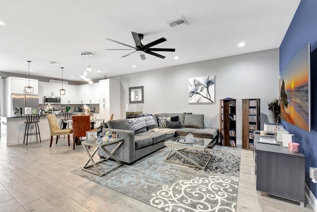 166 Neva Dr, West Palm Beach, FL 33415 - living room featuring ceiling fan, recessed lighting, and light wood-style floors