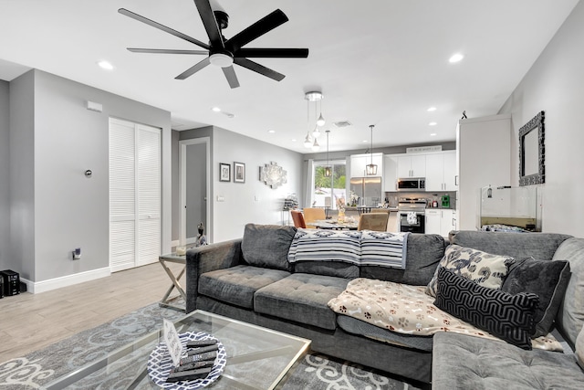 166 Neva Dr, West Palm Beach, FL 33415 - living area featuring light wood-style floors, ceiling fan, recessed lighting, and baseboards