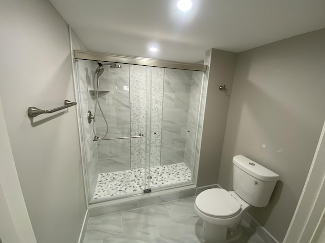 15324 Lakes Of Delray Blvd Unit 104, Delray Beach, FL 33484 - bathroom featuring marble finish flooring, toilet, a shower stall, baseboards, and recessed lighting