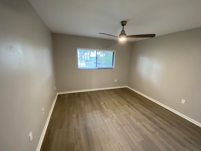 empty room featuring ceiling fan and wood-type flooring