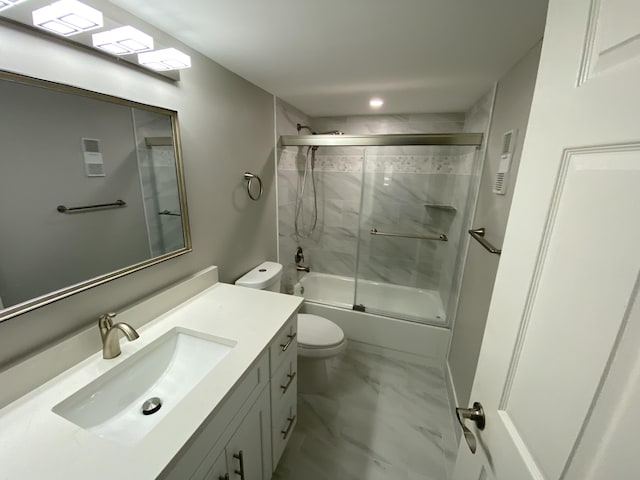 15324 Lakes Of Delray Blvd Unit 104, Delray Beach, FL 33484 - full bath with marble look tiles, toilet, vanity, and enclosed tub / shower combo