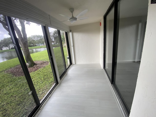 15324 Lakes Of Delray Blvd Unit 104, Delray Beach, FL 33484 - unfurnished sunroom with a water view
