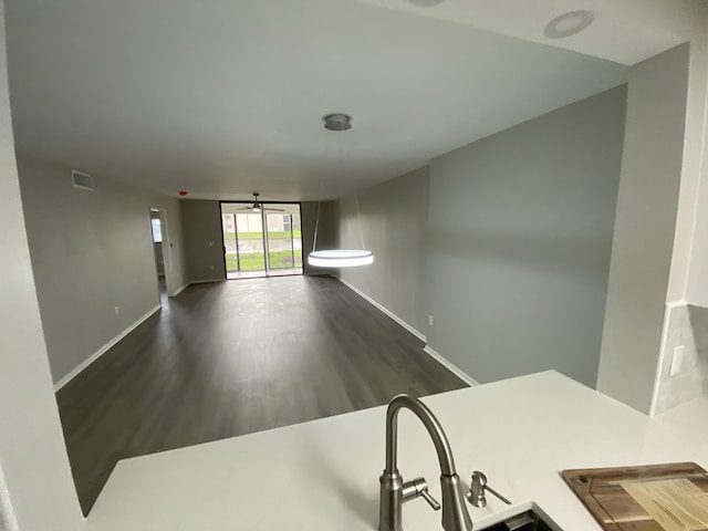 15324 Lakes Of Delray Blvd Unit 104, Delray Beach, FL 33484 - empty room featuring baseboards, wood finished floors, and ceiling fan