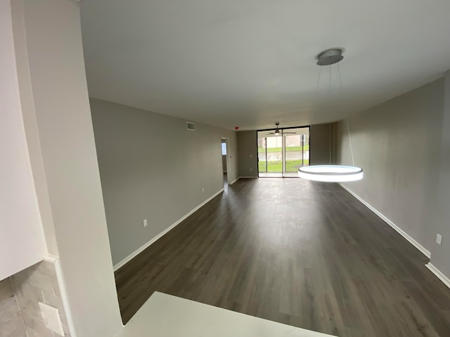 unfurnished room featuring dark hardwood / wood-style flooring